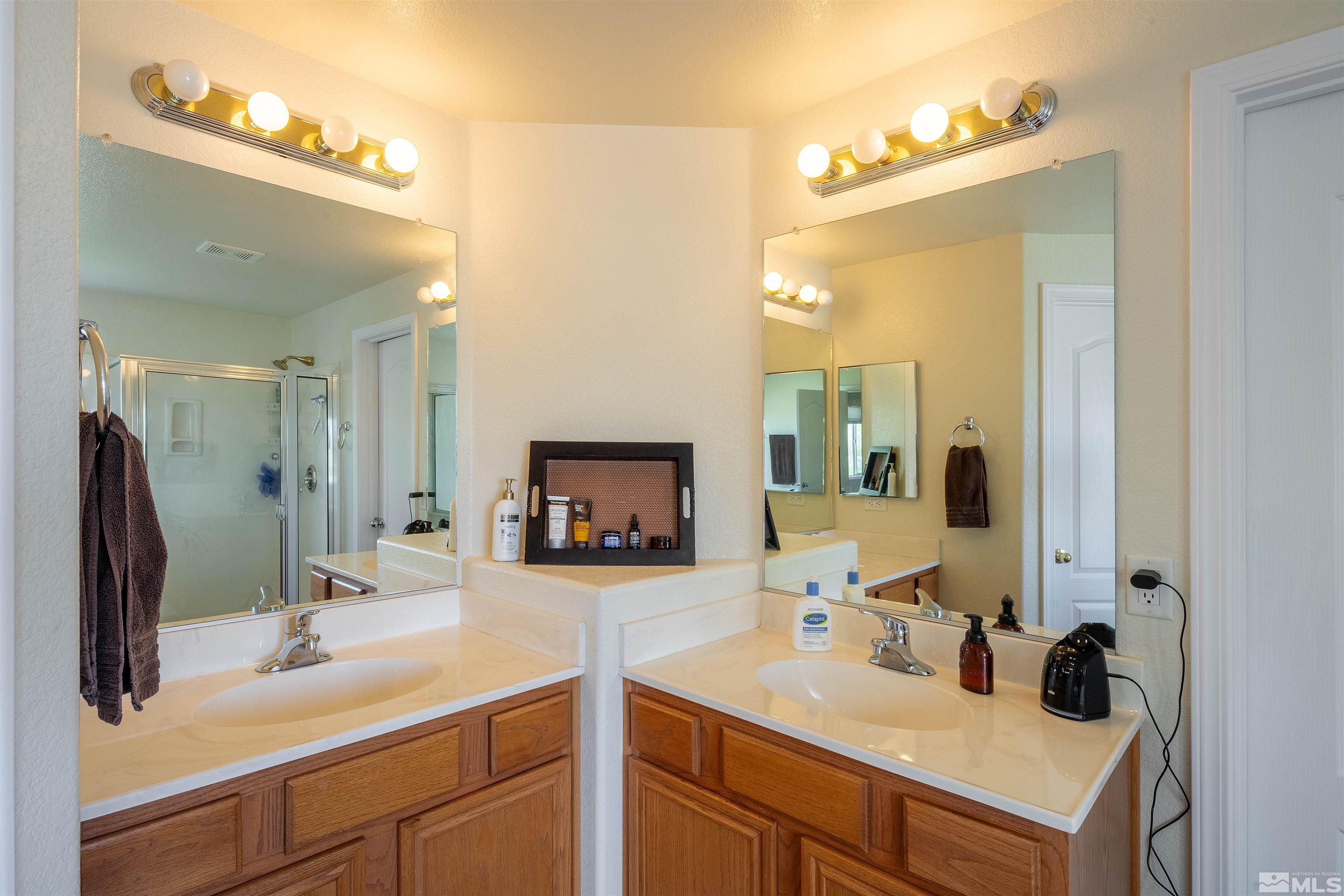 2325 Lincoln Meadows Drive Reno, NV 89521 - Photo 30 of 33 a bathroom with a sink and a mirror