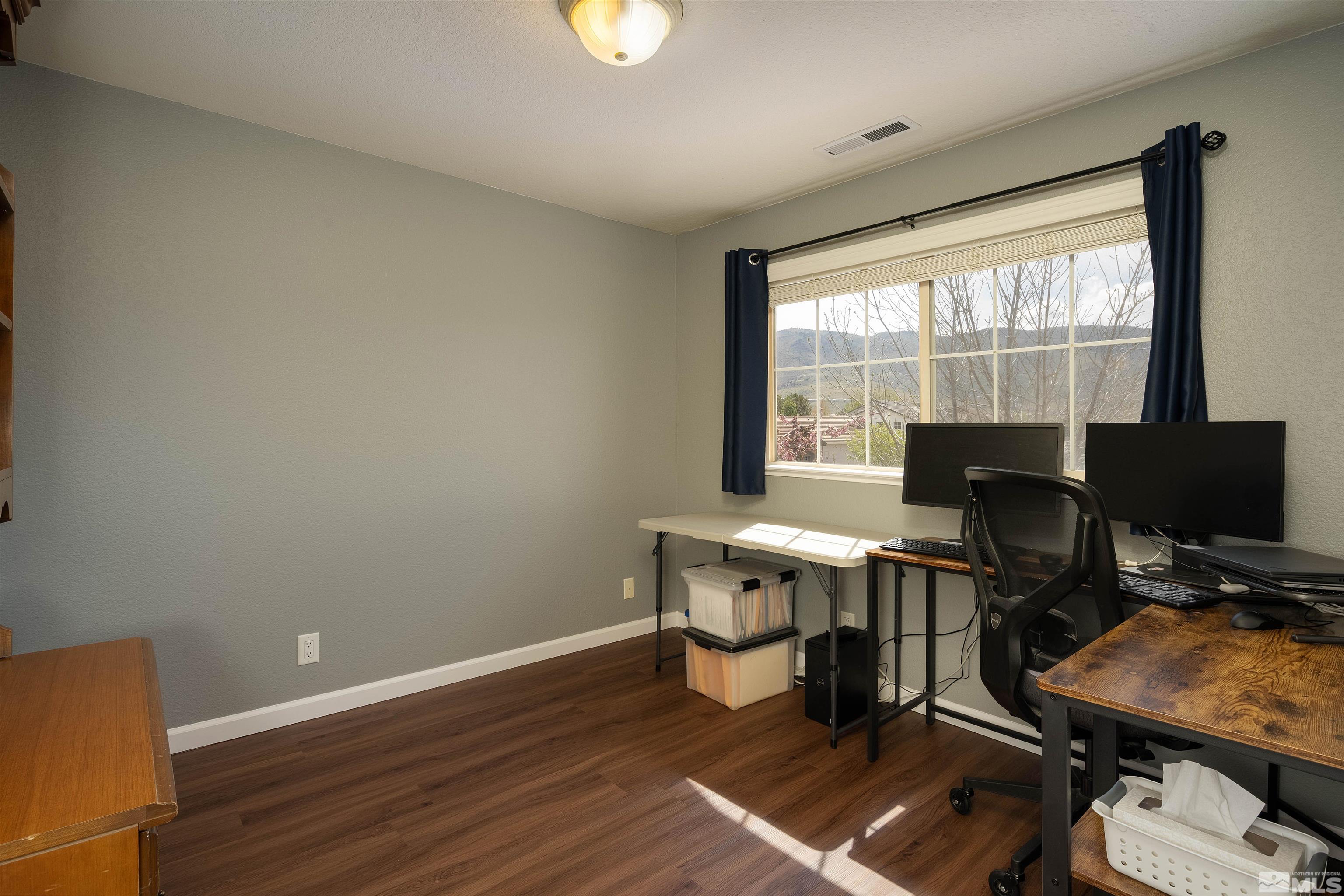 2325 Lincoln Meadows Drive Reno, NV 89521 - Photo 31 of 33 a view of a workspace with furniture and a window