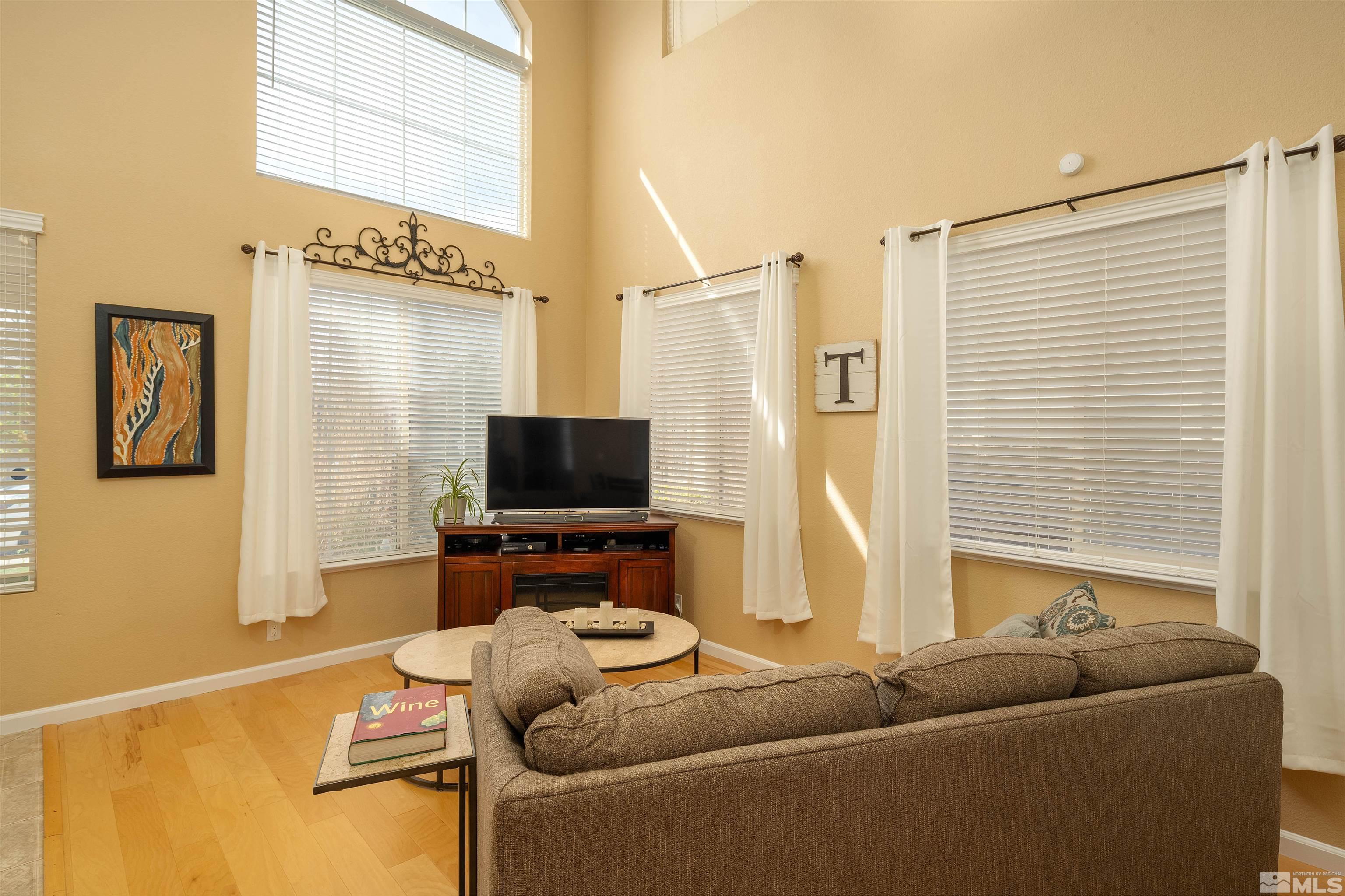 2325 Lincoln Meadows Drive Reno, NV 89521 - Photo 10 of 33 a living room with furniture and a flat screen tv