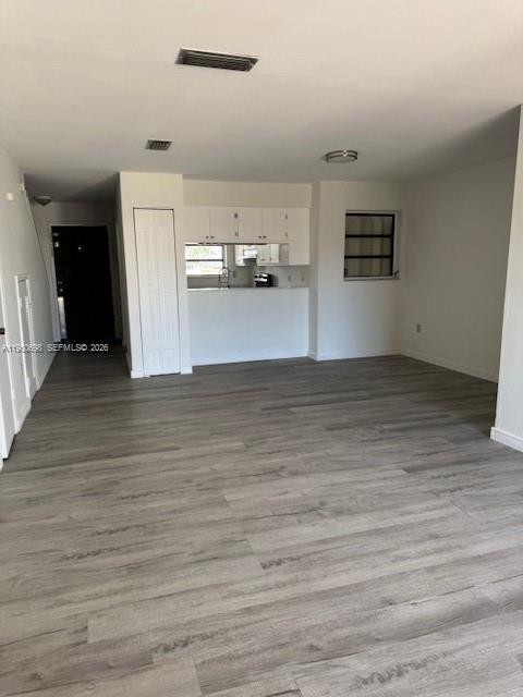 13404 Southwest 62nd Street, Unit 101L Miami, FL 33183 - Photo 11 of 46 a view of a kitchen with wooden floor
