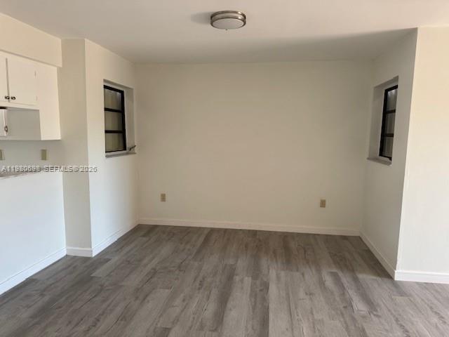13404 Southwest 62nd Street, Unit 101L Miami, FL 33183 - Photo 12 of 46 wooden floor in an empty room