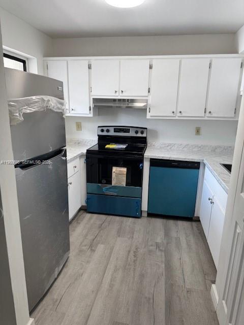 13404 Southwest 62nd Street, Unit 101L Miami, FL 33183 - Photo 15 of 46 a kitchen with a refrigerator sink and cabinets