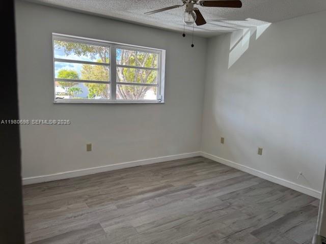 13404 Southwest 62nd Street, Unit 101L Miami, FL 33183 - Photo 18 of 46 an empty room with a window