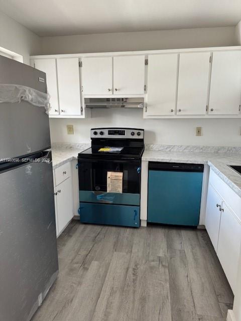 13404 Southwest 62nd Street, Unit 101L Miami, FL 33183 - Photo 2 of 46 a kitchen with granite countertop a stove top oven and cabinets