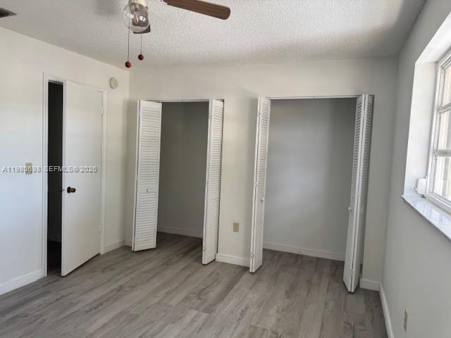 13404 Southwest 62nd Street, Unit 101L Miami, FL 33183 - Photo 22 of 46 an empty room with wooden floor and a window