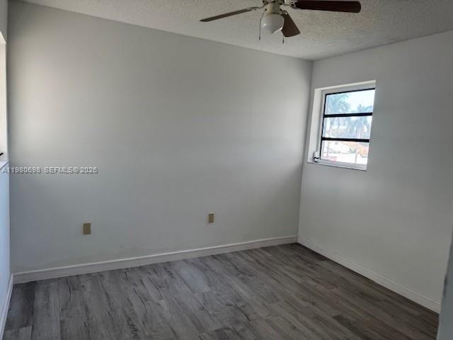 13404 Southwest 62nd Street, Unit 101L Miami, FL 33183 - Photo 28 of 46 an empty room with a window and a ceiling fan