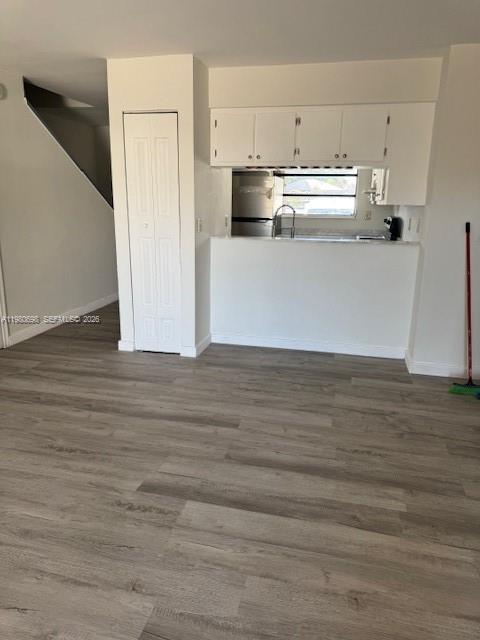 13404 Southwest 62nd Street, Unit 101L Miami, FL 33183 - Photo 3 of 46 a view of a kitchen with wooden floor