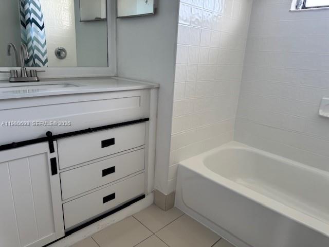 13404 Southwest 62nd Street, Unit 101L Miami, FL 33183 - Photo 40 of 46 a bathroom with a bathtub and sink