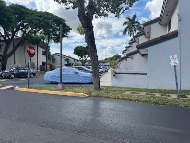 13404 Southwest 62nd Street, Unit 101L Miami, FL 33183 - Photo 41 of 46 a view of a house with basketball court