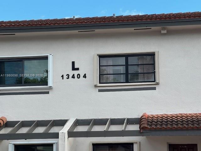 13404 Southwest 62nd Street, Unit 101L Miami, FL 33183 - Photo 43 of 46 a view of kitchen and utility room