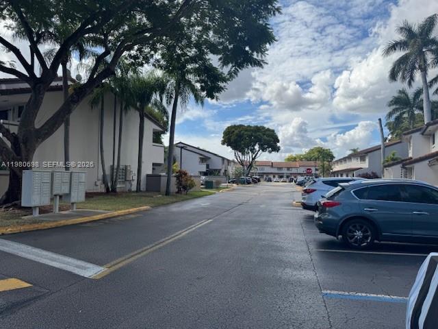 13404 Southwest 62nd Street, Unit 101L Miami, FL 33183 - Photo 44 of 46 a view of street with parked cars