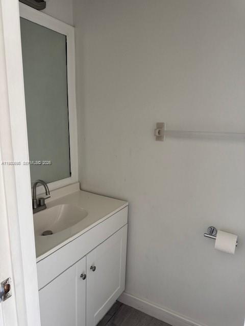 13404 Southwest 62nd Street, Unit 101L Miami, FL 33183 - Photo 8 of 46 a bathroom with a sink and vanity