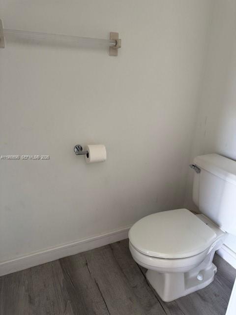 13404 Southwest 62nd Street, Unit 101L Miami, FL 33183 - Photo 9 of 46 a white toilet sitting next to a shower