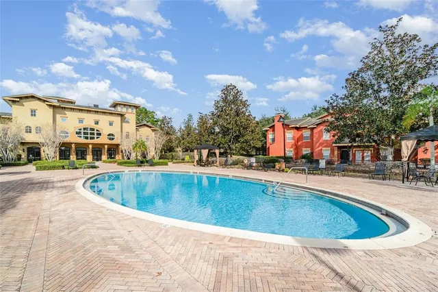 a view of a swimming pool and a chairs