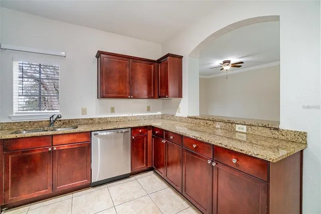 a kitchen with a sink and a wooden cabinets