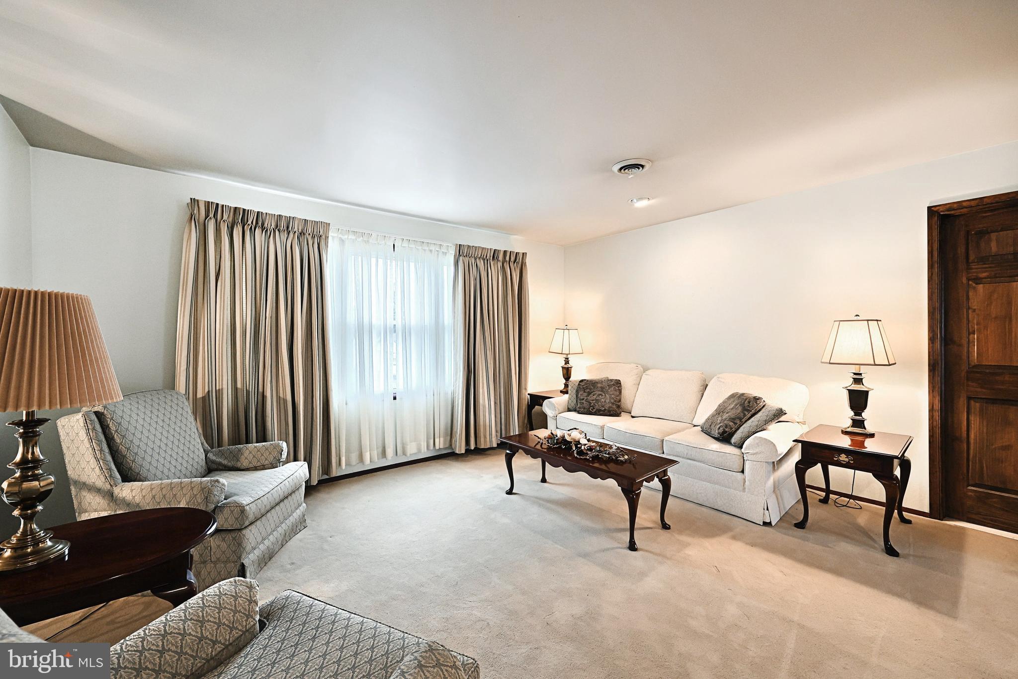 406 Spring Forge Drive Spring Grove, PA 17362 - Photo 16 of 53 a living room with furniture and a large window