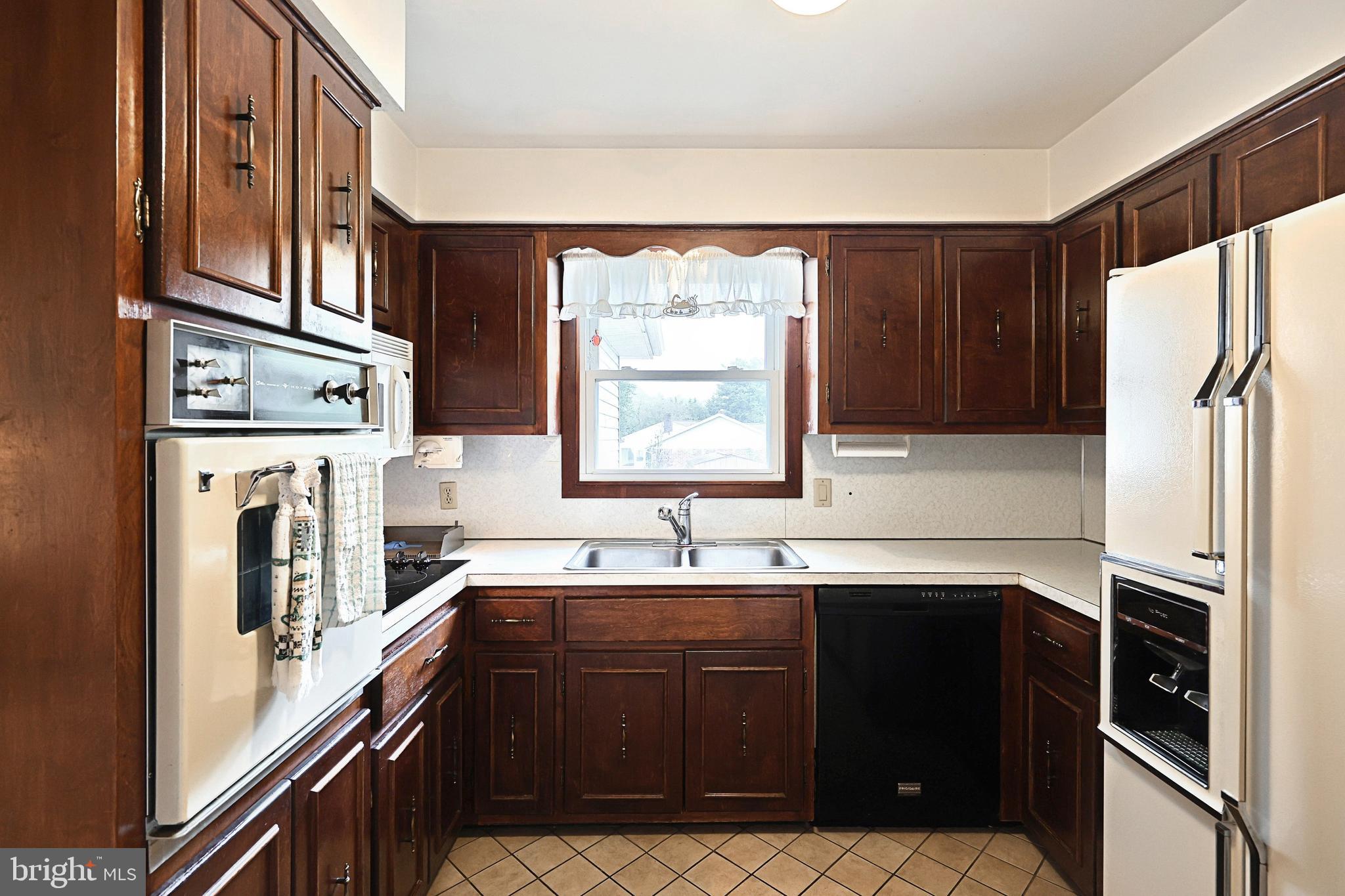 406 Spring Forge Drive Spring Grove, PA 17362 - Photo 21 of 53 a kitchen with stainless steel appliances granite countertop a refrigerator and a sink