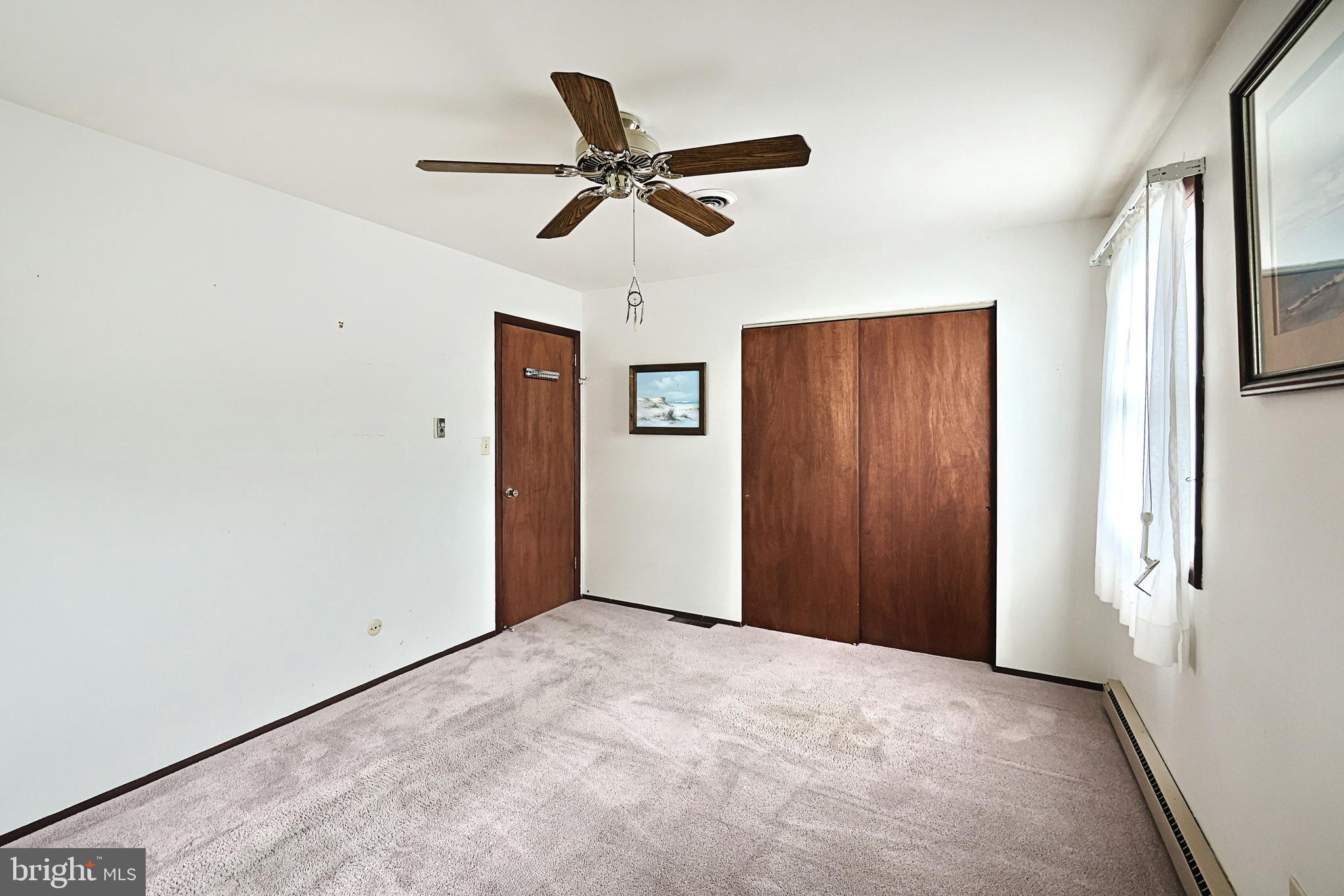406 Spring Forge Drive Spring Grove, PA 17362 - Photo 25 of 53 a view of a livingroom with a ceiling fan and window