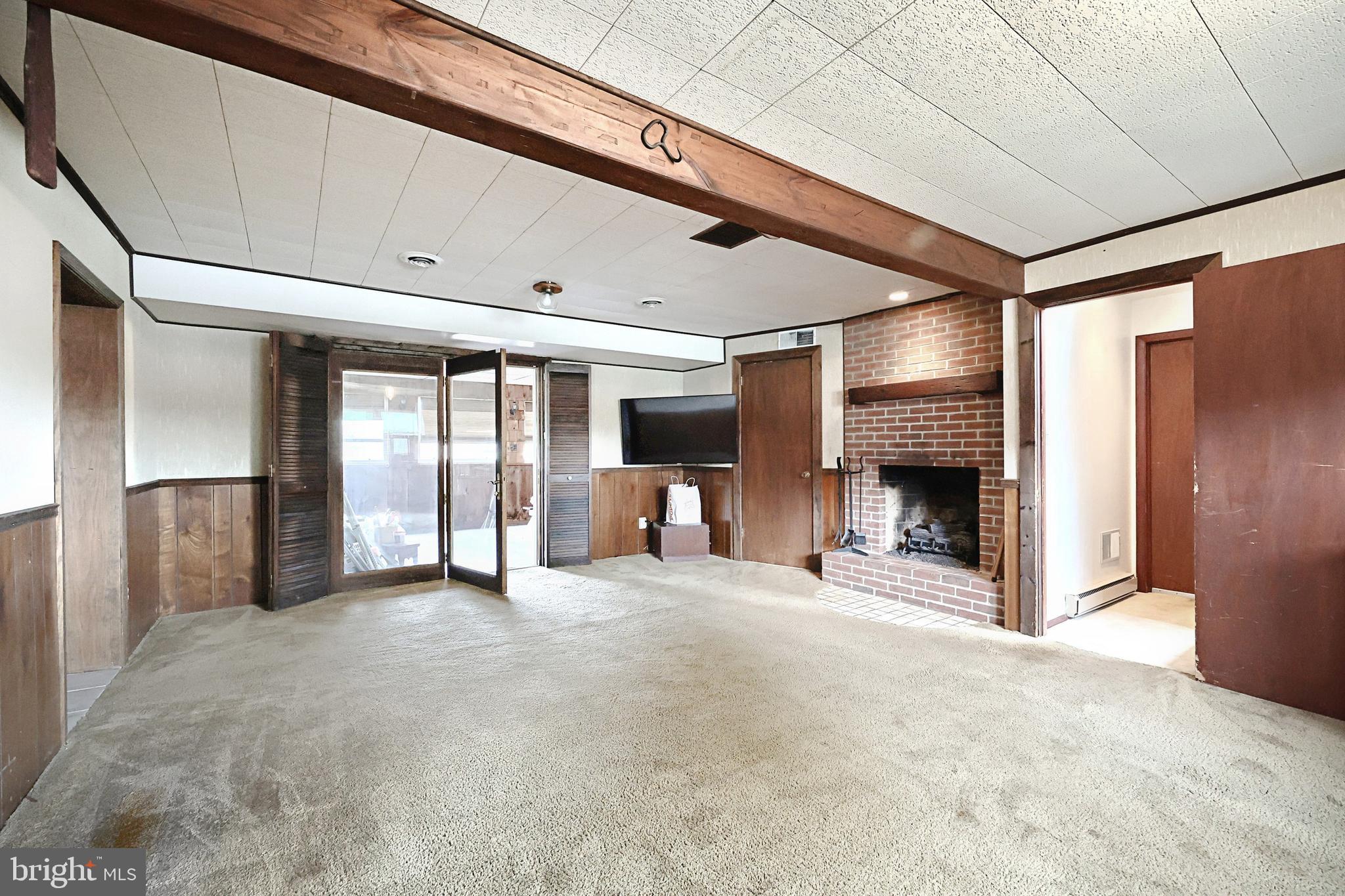 406 Spring Forge Drive Spring Grove, PA 17362 - Photo 31 of 53 a view of an empty room with window and fire place