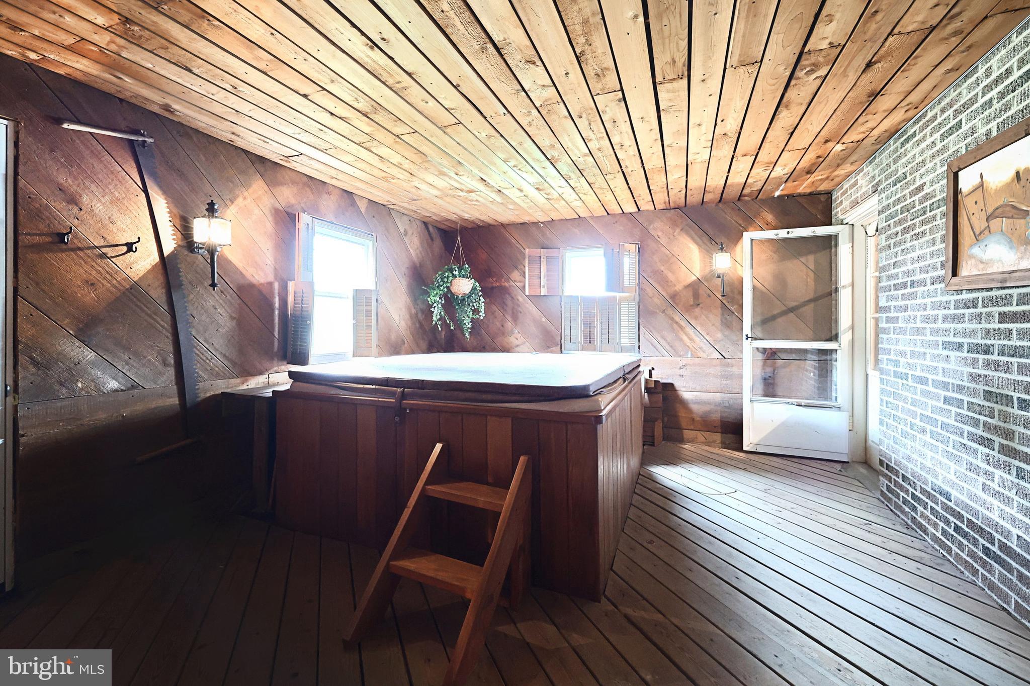 406 Spring Forge Drive Spring Grove, PA 17362 - Photo 35 of 53 a kitchen with stainless steel appliances wooden floors and table chairs
