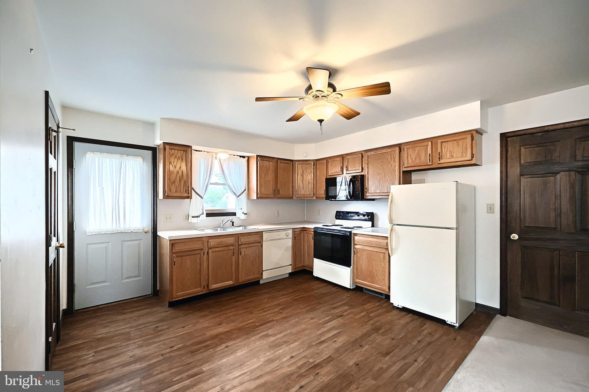 406 Spring Forge Drive Spring Grove, PA 17362 - Photo 38 of 53 a kitchen with a refrigerator and a stove top oven