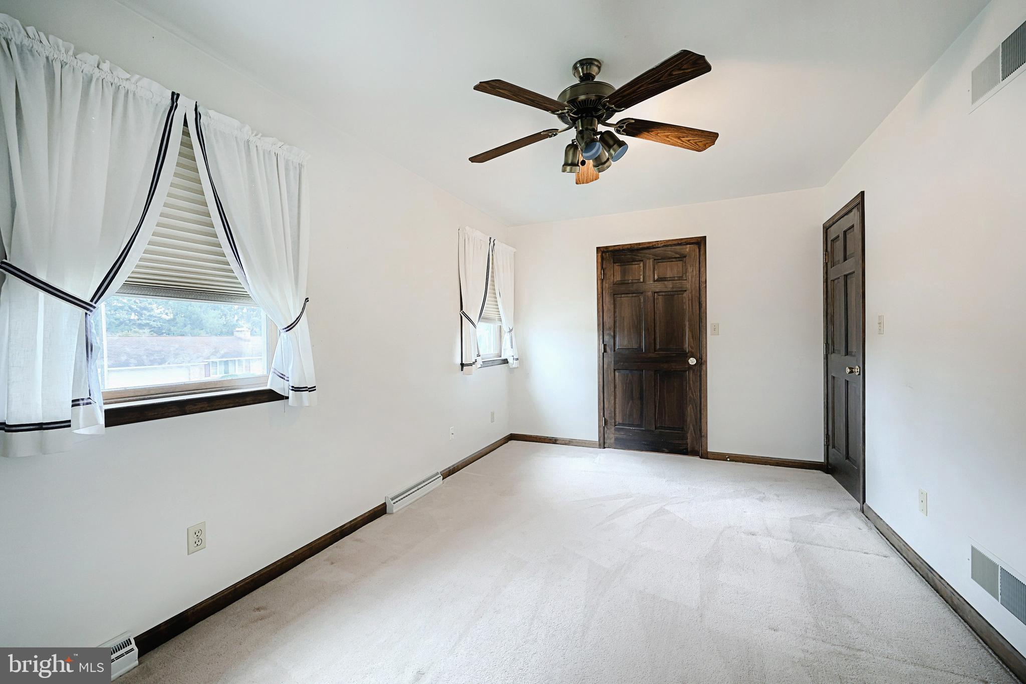 406 Spring Forge Drive Spring Grove, PA 17362 - Photo 41 of 53 a view of a livingroom with a ceiling fan and window