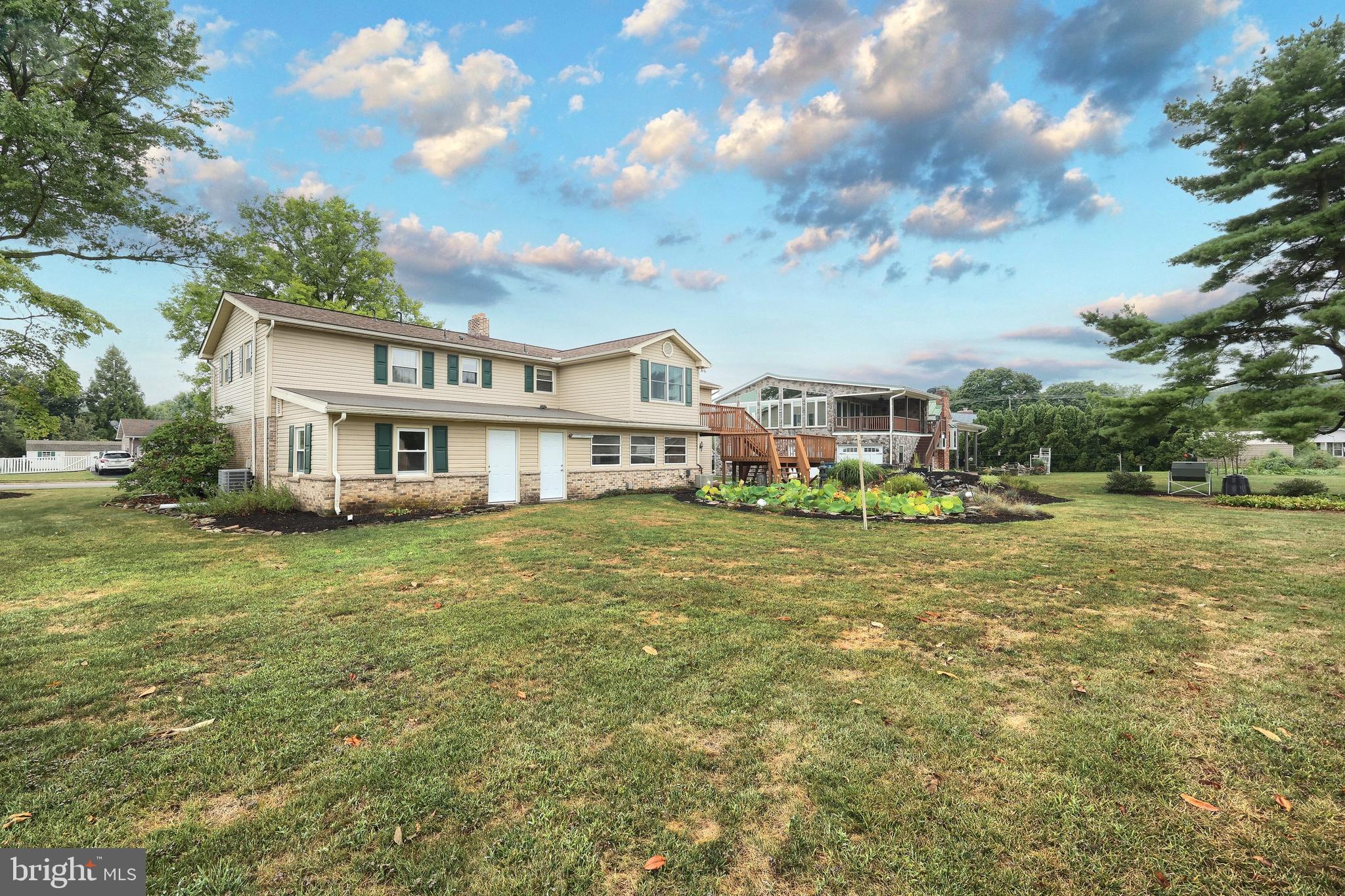 406 Spring Forge Drive Spring Grove, PA 17362 - Photo 9 of 53 a front view of a house with a garden
