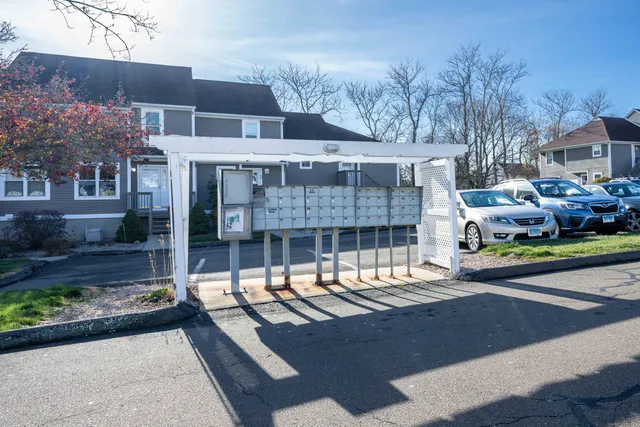 a view of a house with swimming pool and sitting area