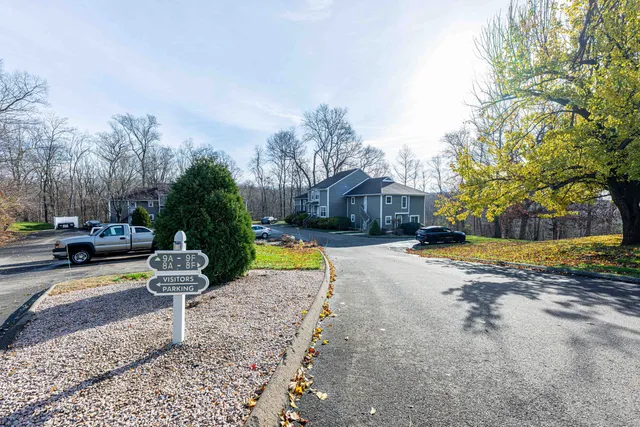 a view of a street with cars on road