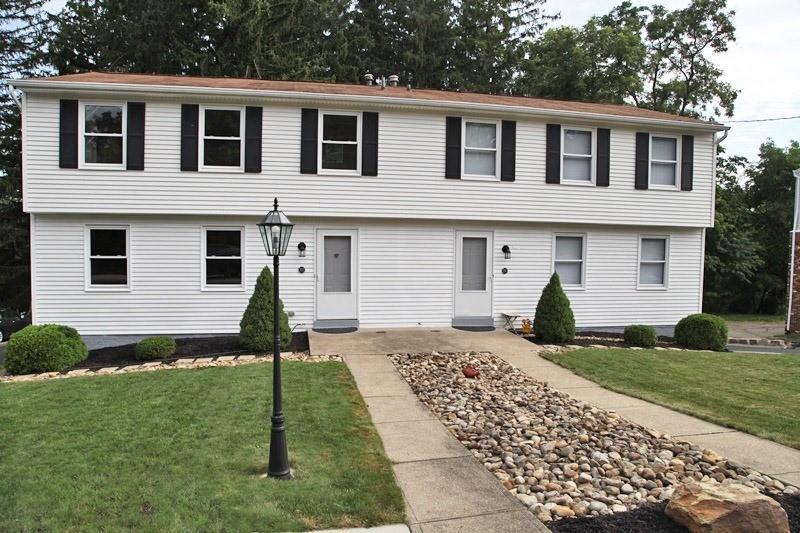 390-392 Sunset Road Pittsburgh, PA 15237 - Photo 1 of 25 a front view of a house with a garden