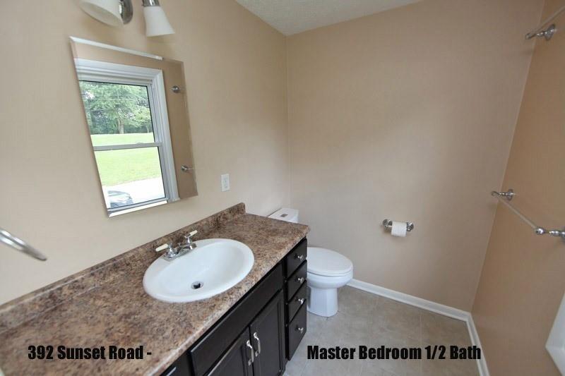 390-392 Sunset Road Pittsburgh, PA 15237 - Photo 13 of 25 a bathroom with a granite countertop sink and a mirror