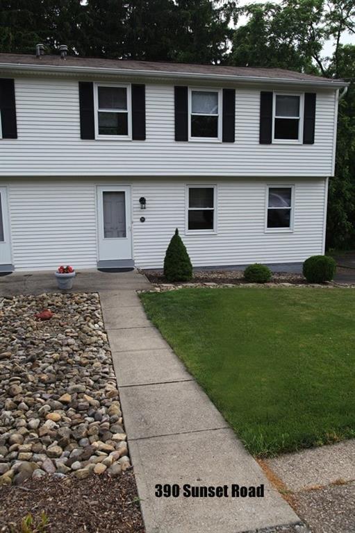 390-392 Sunset Road Pittsburgh, PA 15237 - Photo 16 of 25 a front view of a house with a yard