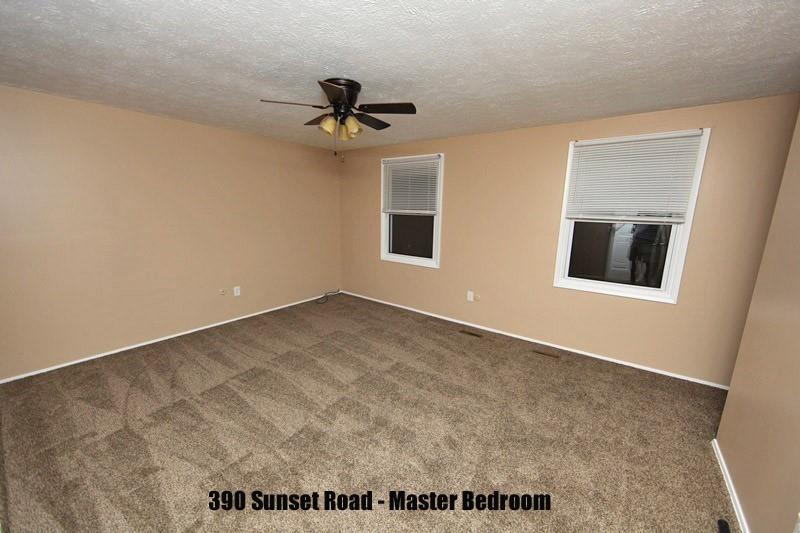 390-392 Sunset Road Pittsburgh, PA 15237 - Photo 21 of 25 an empty room with a window and a ceiling fan