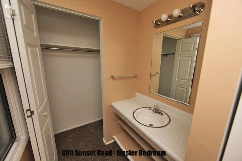 390-392 Sunset Road Pittsburgh, PA 15237 - Photo 22 of 25 a bathroom with a sink a toilet and a mirror