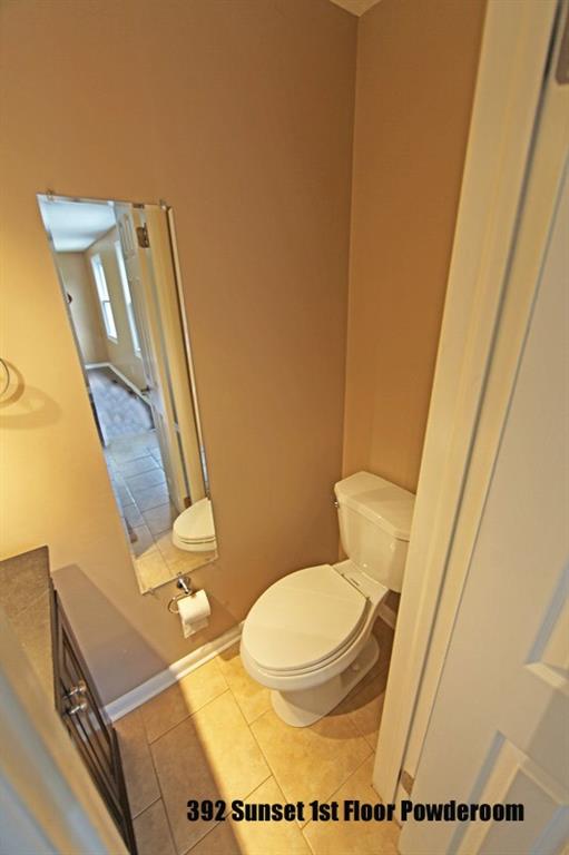 390-392 Sunset Road Pittsburgh, PA 15237 - Photo 8 of 25 a bathroom with a toilet and a mirror