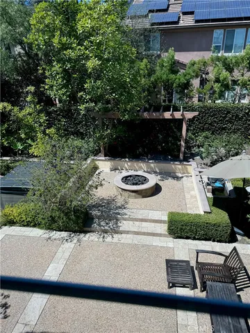 a view of swimming pool with outdoor seating and plants
