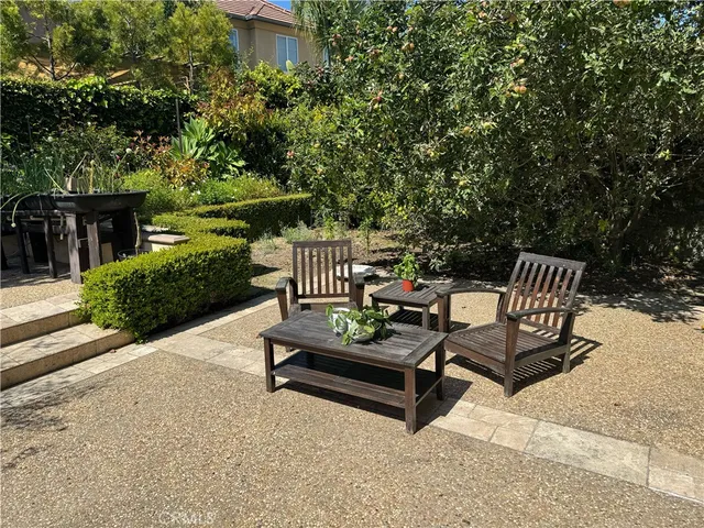 a view of a bench in a backyard