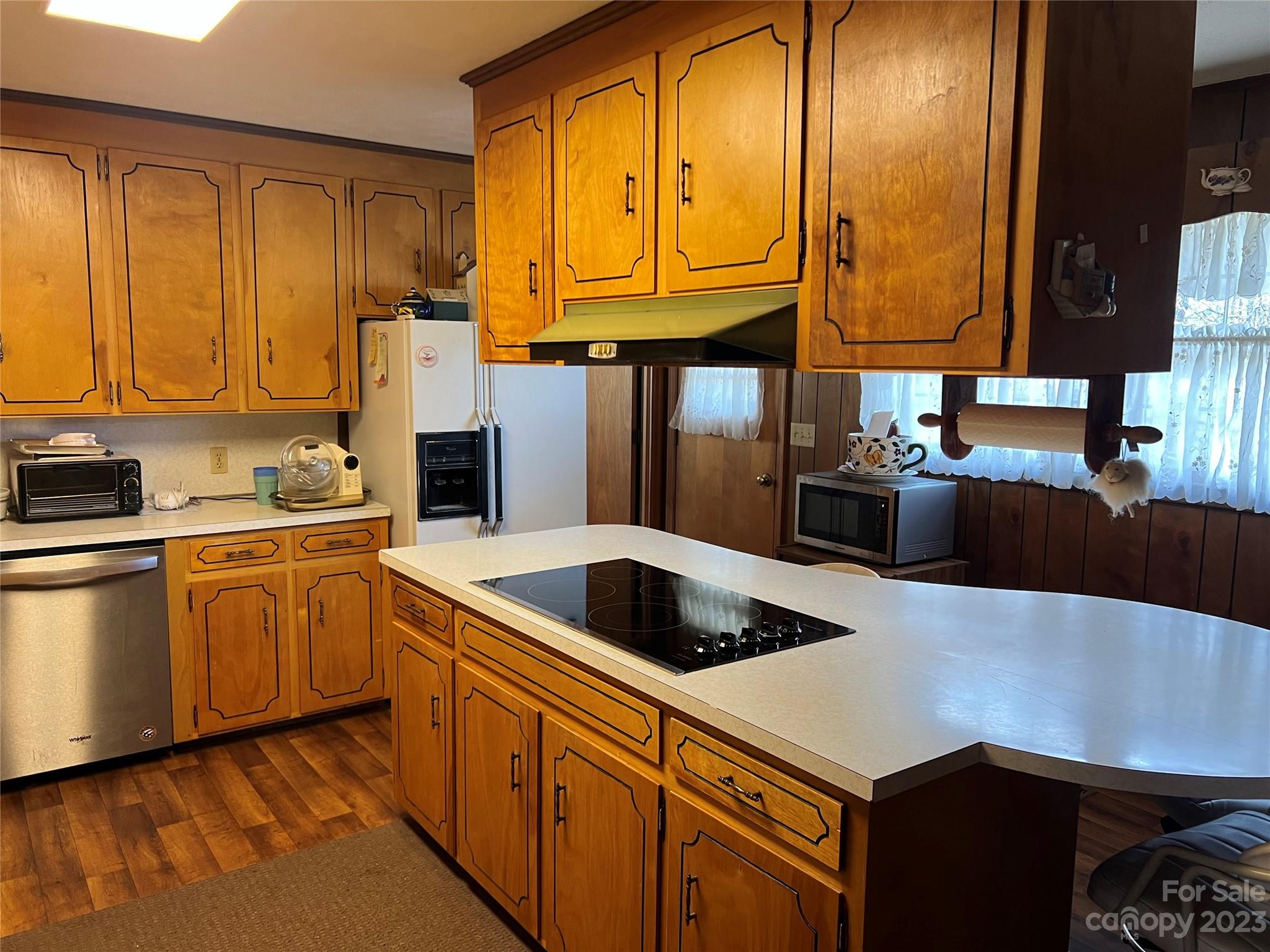 682 Summers Road Valdese, NC 28690 - Photo 12 of 45 a kitchen with stainless steel appliances a sink a stove and a refrigerator