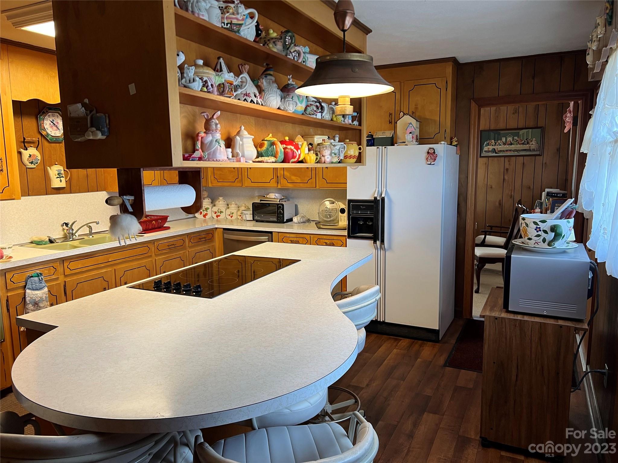682 Summers Road Valdese, NC 28690 - Photo 13 of 45 a room with wooden floor and chairs