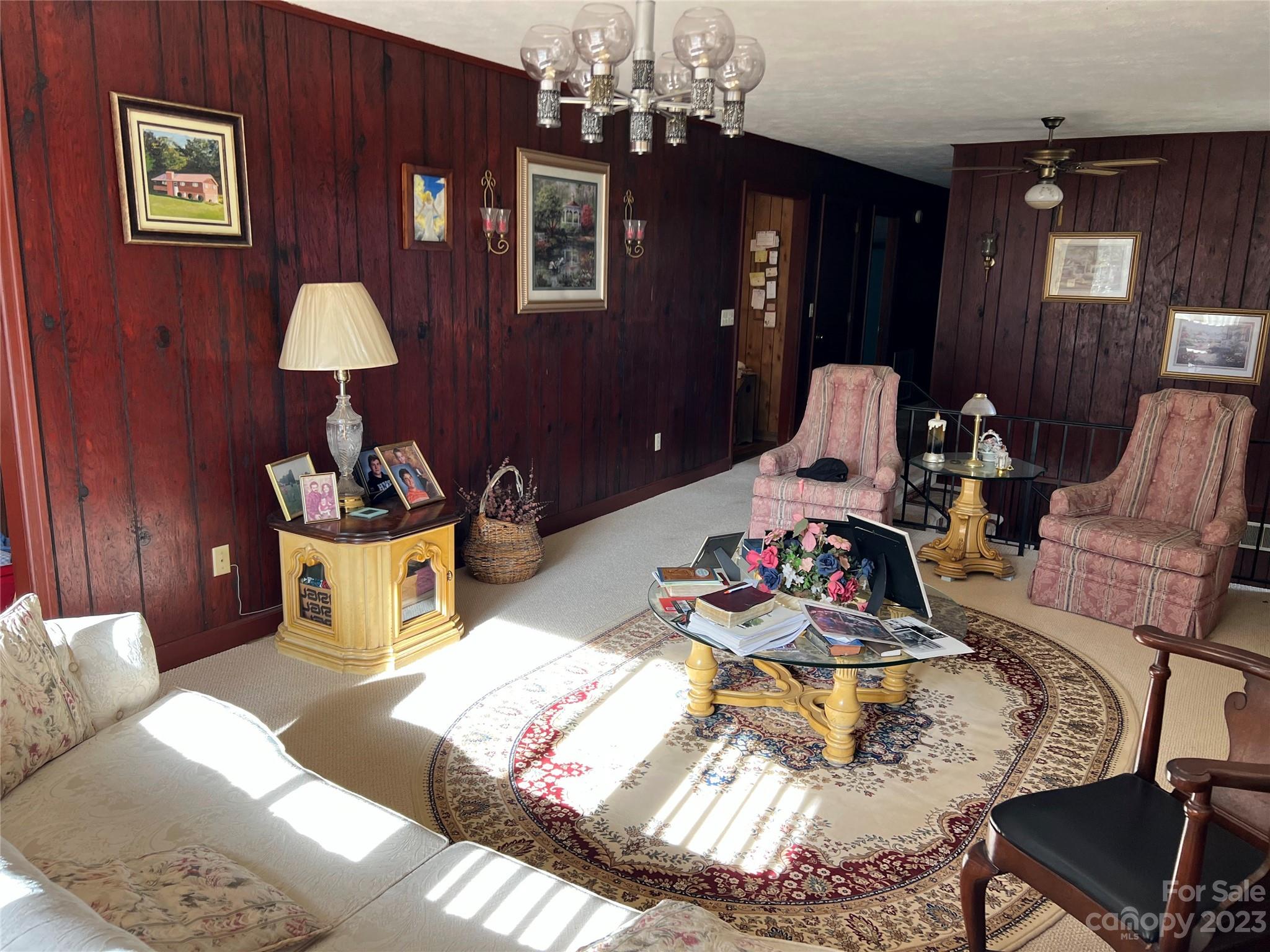 682 Summers Road Valdese, NC 28690 - Photo 17 of 45 a living room with furniture and a chandelier