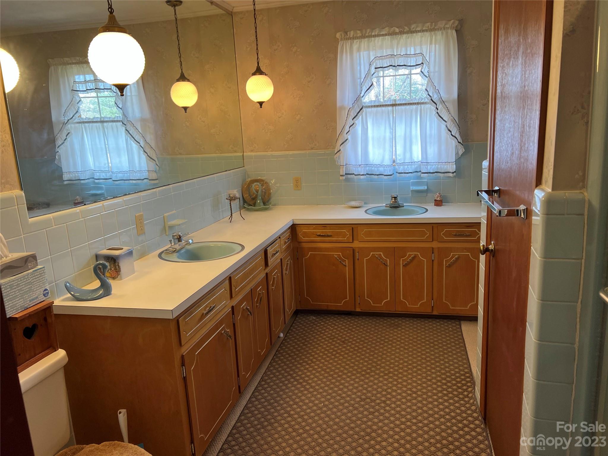 682 Summers Road Valdese, NC 28690 - Photo 21 of 45 a bathroom with a sink and a mirror