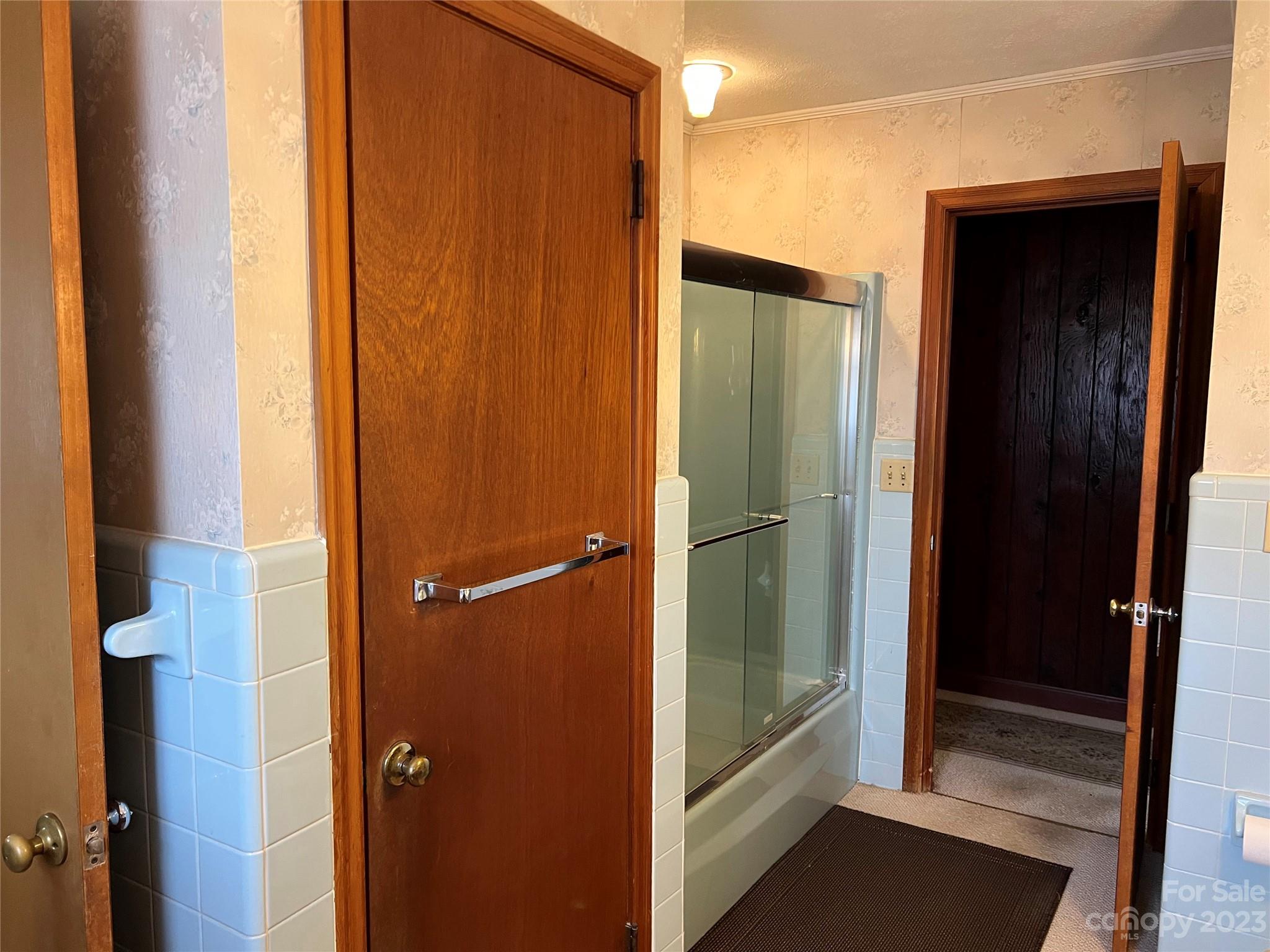 682 Summers Road Valdese, NC 28690 - Photo 22 of 45 view of bathroom with tub and door