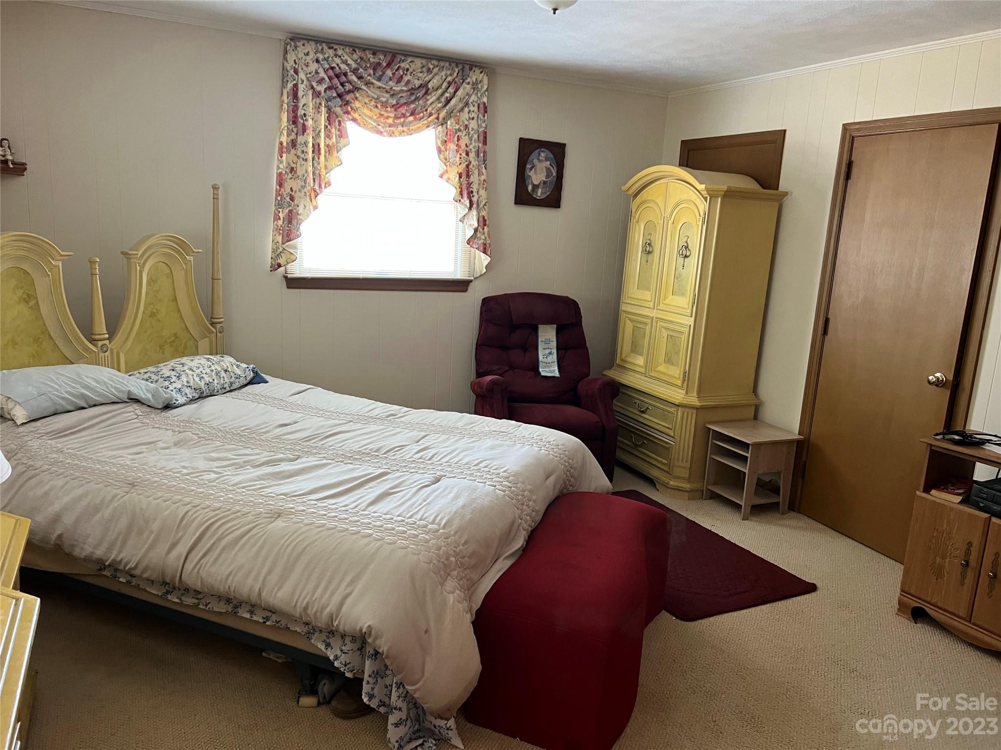 682 Summers Road Valdese, NC 28690 - Photo 24 of 45 a bedroom with a bed and a mirror