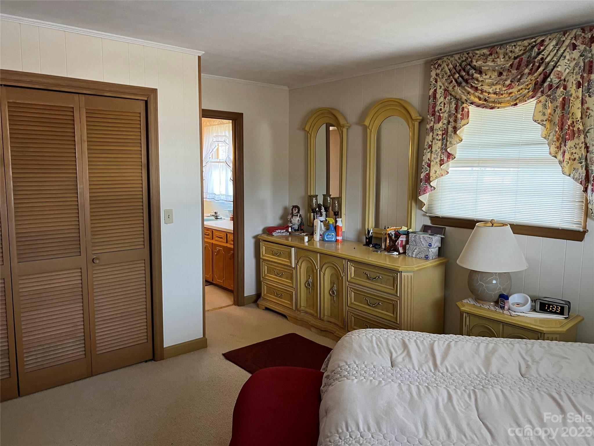 682 Summers Road Valdese, NC 28690 - Photo 26 of 45 a bedroom with a bed and a mirror