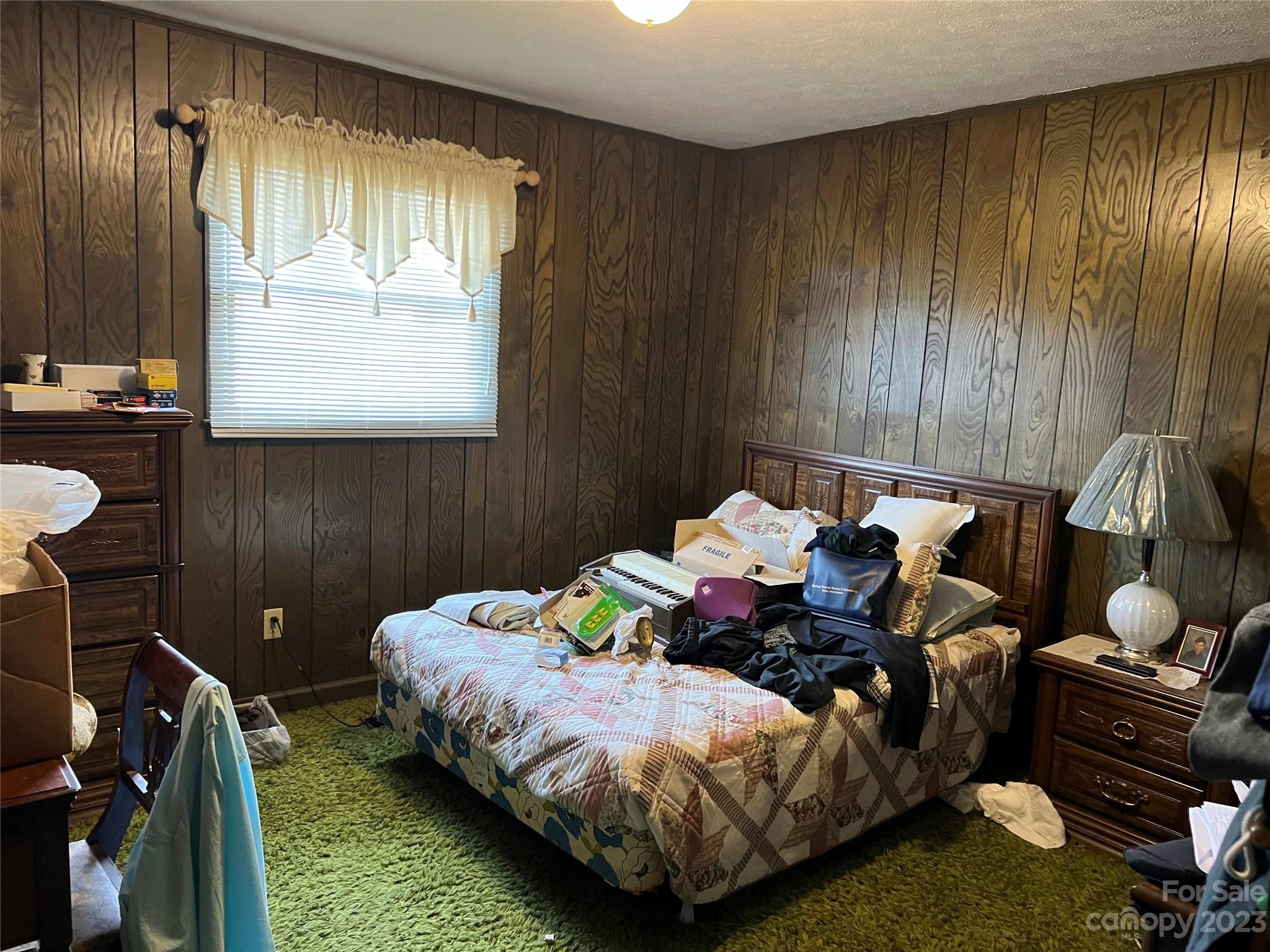 682 Summers Road Valdese, NC 28690 - Photo 28 of 45 a bed room with a bed and a chair