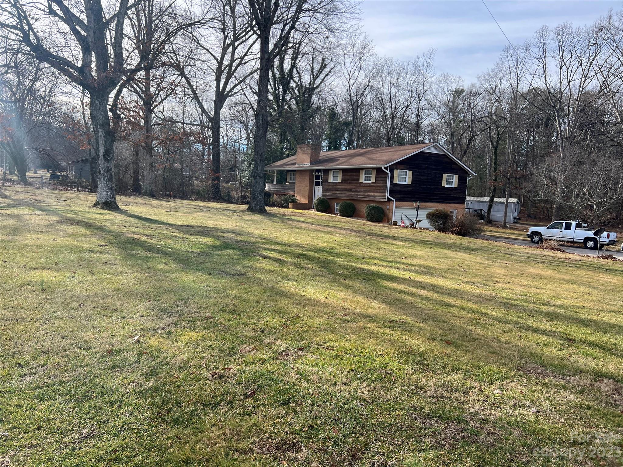682 Summers Road Valdese, NC 28690 - Photo 3 of 45 a view of a house with a yard covered in snow