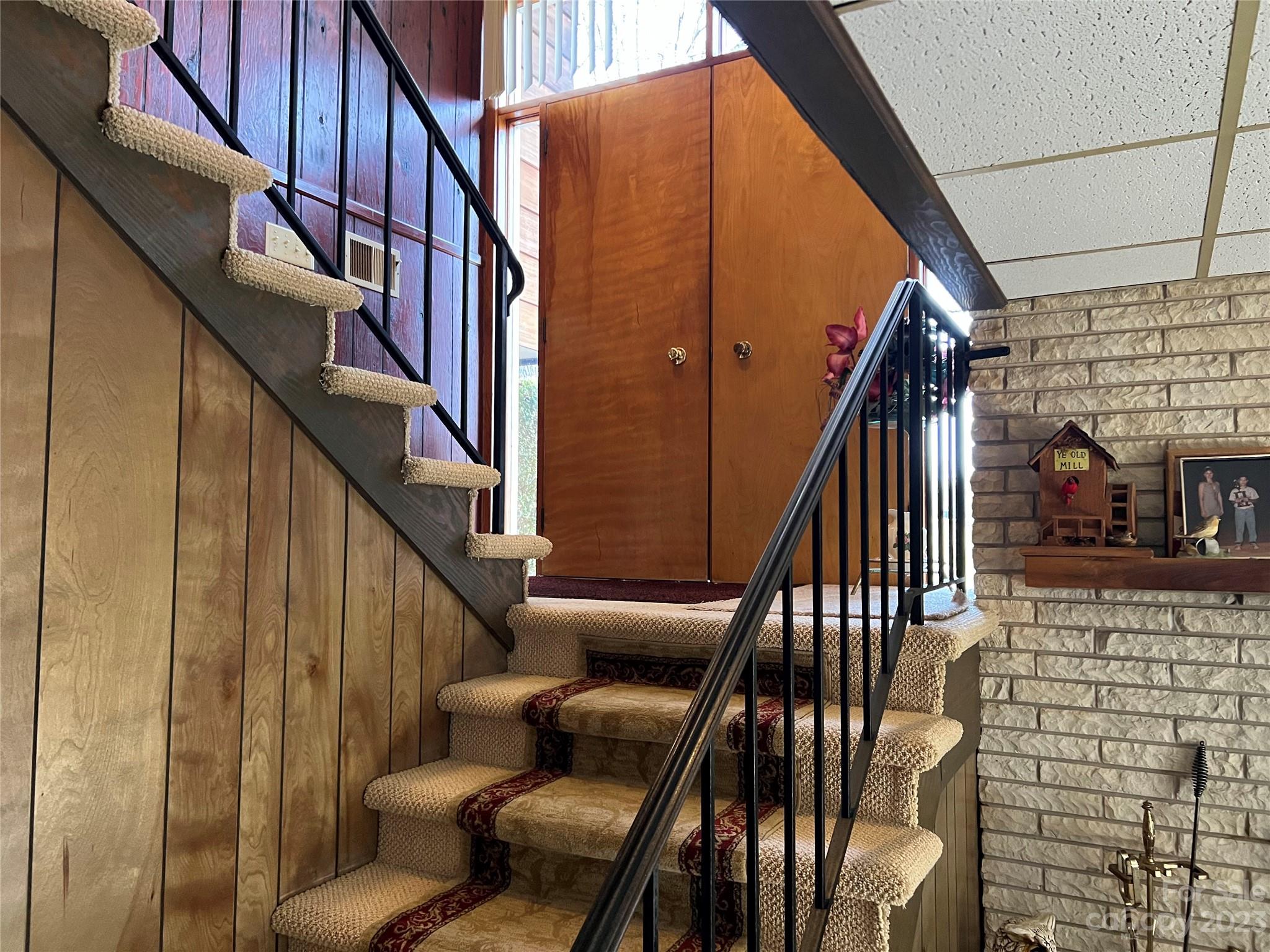 682 Summers Road Valdese, NC 28690 - Photo 31 of 45 a view of entryway with wooden floor and stairs