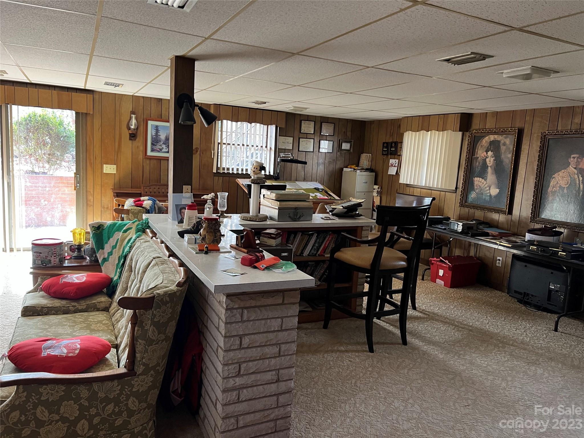 682 Summers Road Valdese, NC 28690 - Photo 33 of 45 a room with furniture a chandelier and a window