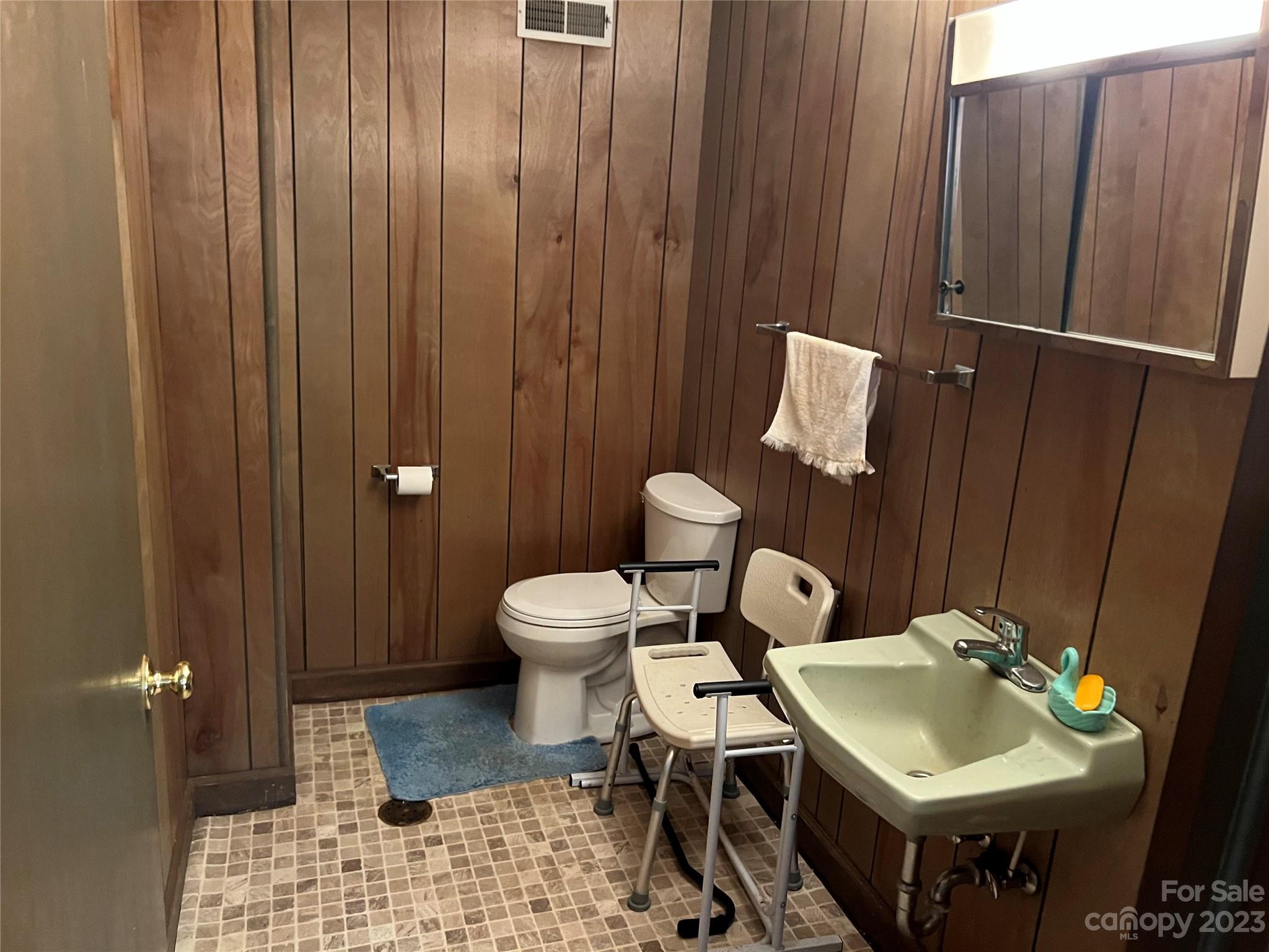 682 Summers Road Valdese, NC 28690 - Photo 36 of 45 a bathroom with a sink toilet and shower