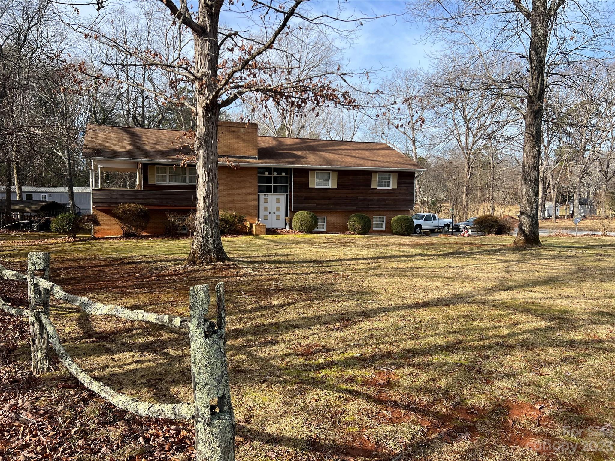 682 Summers Road Valdese, NC 28690 - Photo 4 of 45 a front view of a building with trees